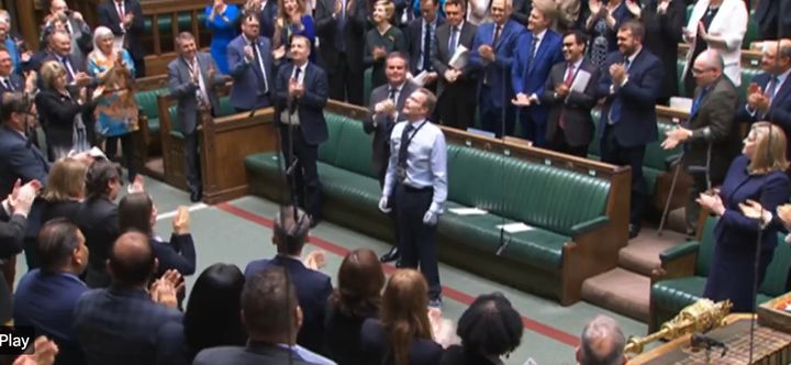 MPs stand to applaud as Craig Mackinlay returns to the Commons.