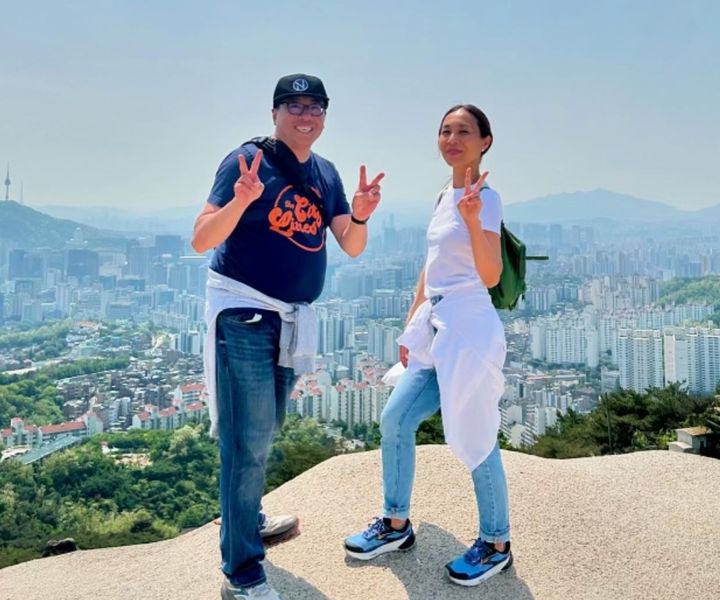 The author and her husband pose for a photo in Seoul, South Korea, in 2024.