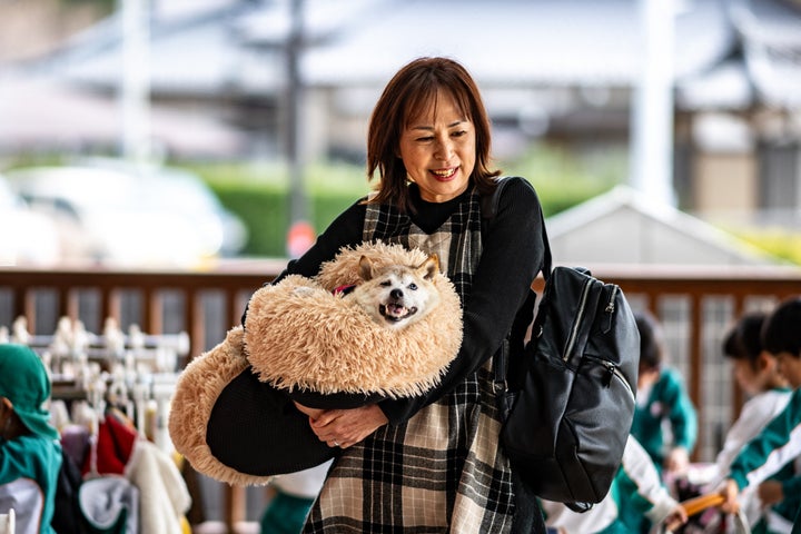 Atsuko Sato with Kabosu in March.