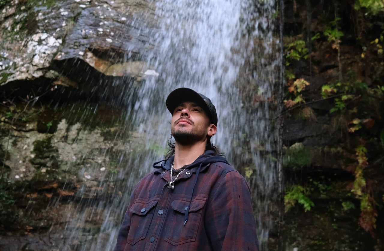 Portugal Is At Conflict With Itself Over ‘White Gold’ - The Boston Courier 3 Aurik Antunes, 33, a Portuguese artist and barber living in Covas do Barroso, Portugal, visits a waterfall, one of the natural waterways local opponents of the lithium project fear will be threatened by the mining.