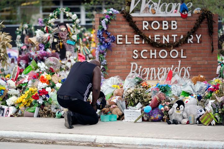 Reggie Daniels pays his respects a memorial at Robb Elementary School, Thursday, June 9, 2022, in Uvalde, Texas. (AP Photo/Eric Gay)