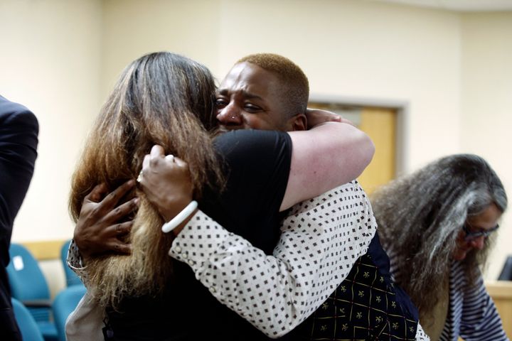 Eric Posey of Post Falls, Idaho, embraces a supporter in court after a jury awarded him more than $1.1 million in damages in his defamation lawsuit against conservative blogger Summer Bushnell, May 24, 2024.