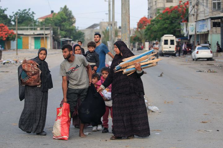 Palestinians flee the area of Tal al-Sultan in Rafah with their belongings following renewed Israeli strikes.