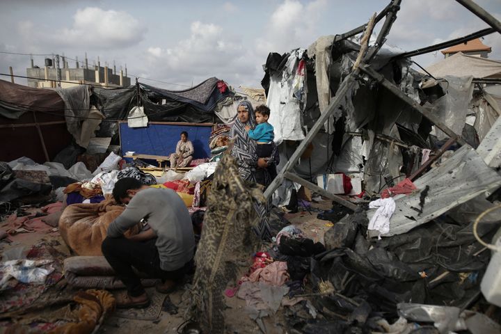 Displaced Palestinians inspect their tents destroyed by Israel's bombardment, adjunct to an UNRWA facility west of Rafah city, Gaza Strip, on May 28, 2024.