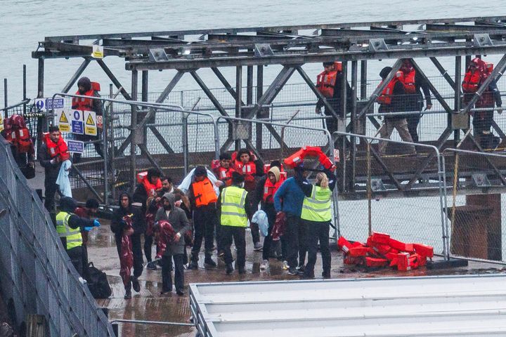 Migrants are brought ashore after being picked up in the English Channel by a Border Force vessel on November 16, 2023 in Dover, United Kingdom.