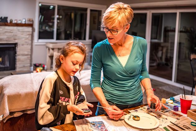 Ella and her surrogate grandmother Christine both enjoy crafting projects.