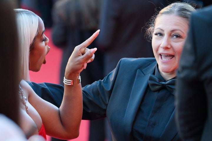 Kelly Rowland points her finger at the female staffer during the Cannes Film Festival.