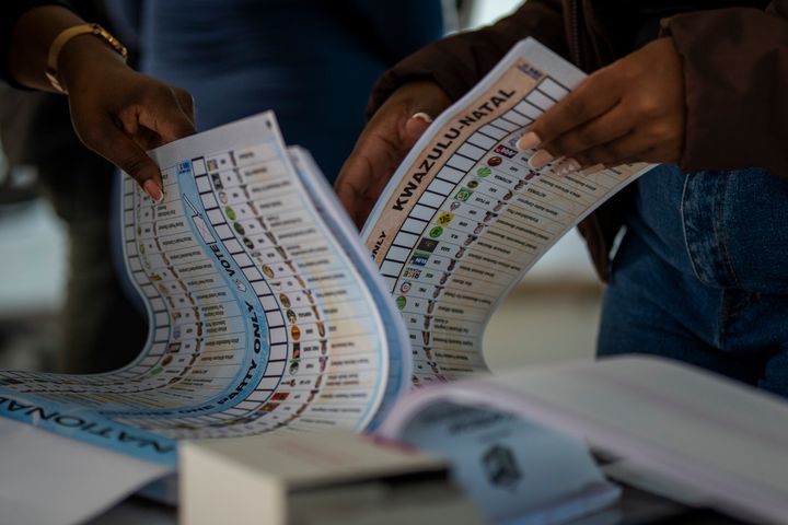 Electoral workers check ballot papers during an especial voting day at Zibambeleni old age home in KwaDadeka, near Durban, South Africa, Monday, May 27, 2024. (AP Photo/Emilio Morenatti)