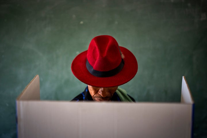 A voter fills out a ballot paper during general elections in Nkandla, Kwazulu Natal, South Africa, Wednesday May 29, 2024. (AP Photo/Emilio Morenatti)