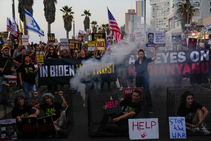 Demonstrators wave signs during a protest calling for the release of the hostages from Hamas captivity in the Gaza Strip, outside of the U.S. Embassy Branch Office in Tel Aviv, Israel, on June 3, 2024.