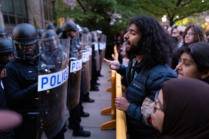 University police are confronted by protestors as they block access to the Main Quadrangle on the University of Chicago campus while they break up a pro-Palestinian encampment on May 7 in Chicago, Illinois.