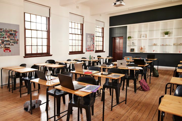Classroom with desks and chairs at high school