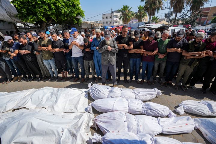 Palestinians mourn relatives killed in an Israeli strike on a U.N.-run school in Gaza's Nuseirat refugee camp, outside a hospital in Deir al-Balah, on Thursday, June 6, 2024.