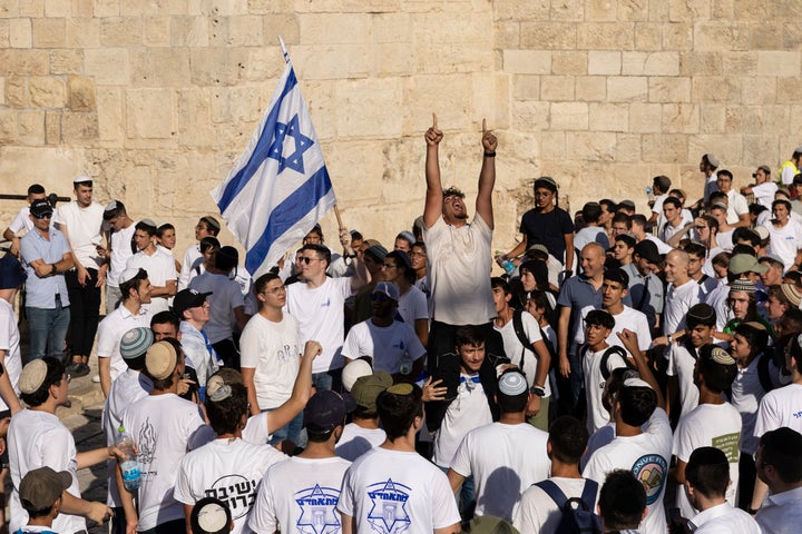 Israeli nationalists celebrate their annual march in the Old City of Jerusalem on June 5, 2024. Attendees chanted racist slogans while marching through the sensitive Palestinian area of the city, as far-right Israeli National Security Minister Itamar Ben-Gvir boasted that Jews prayed freely at a key holy site in violation of decades-old understandings.