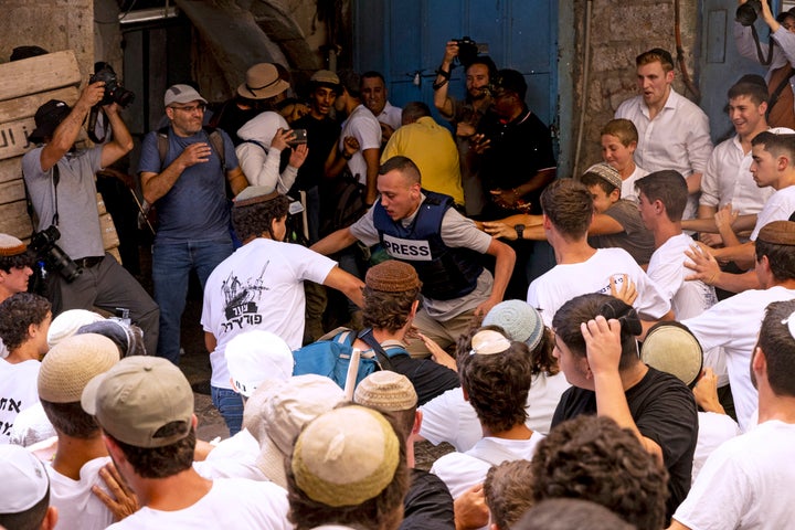 Israeli nationalists attack a journalist during their annual march through a sensitive Palestinian area of Jerusalem on June 5, 2024.