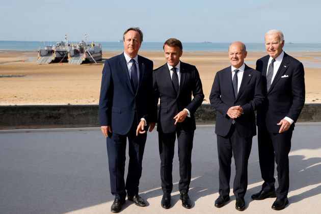 David Cameron with France's President Emmanuel Macron, German Chancellor Olaf Scholz and US President Joe Biden after Sunak left the event.
