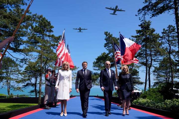 U.S. President Joe Biden, first lady Jill Biden, French President Emmanuel Macron, his wife Brigitte Macron, walk on stage.