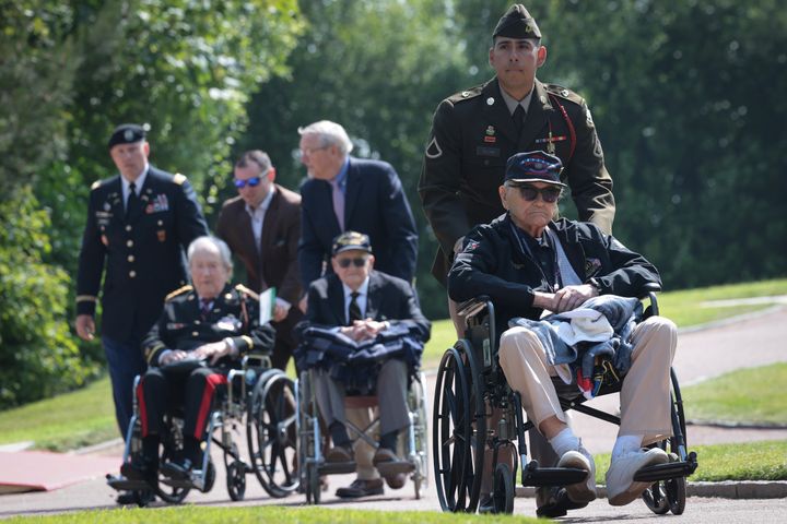 American World War II veterans arrive for a ceremony at the Normandy American Cemetery on the 80th anniversary of D-Day on June 06, 2024 in Colleville-sur-Mer, France.