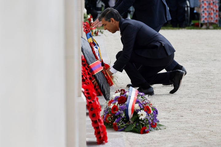 Britain's Prime Minister Rishi Sunak lays a wreath during a commemorative ceremony marking the 80th anniversary of the World War II D-Day" Allied landings in Normandy, at the World War II British Normandy Memorial of Ver-sur-Mer, Thursday, June 6, 2024. (Ludovic Marin/Pool via AP)