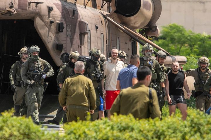 Andrey Kozlov, 27, left, and Almog Meir Jan, 21, two of four hostages who were kidnapped in a Hamas-led attack on Oct. 7, 2023, and were just rescued, arrive by helicopter to the Sheba Medical Center in Ramat Gan, Israel, Saturday, June 8, 2024. (AP Photo/Tomer Appelbaum)