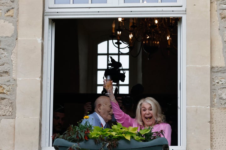 US WWII veteran Harold Terens, 100, left, and Jeanne Swerlin, 96, celebrate their town hall wedding in France.