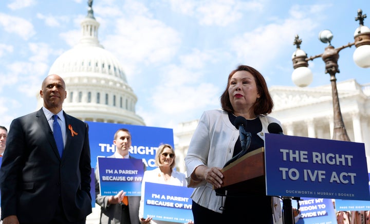 Sen. Tammy Duckworth (D-Ill.) speaks alongside Sen. Cory Booker (D-N.J.) during a news conference on access to IVF treatments outside of the U.S. Capitol Building on June 12, 2024 in Washington, DC.