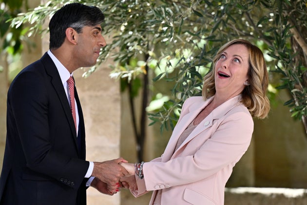 British Prime Minister Rishi Sunak greets Italian Prime Minister Giorgia Meloni