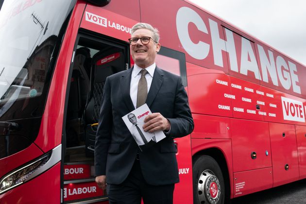 Labour leader Keir Starmer arrives on board his election battle bus at a campaign event in Halesowen after unveiling Labour's manifesto in Manchester.