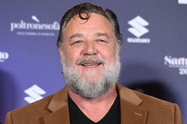 Russell Crowe admitted he was employing some "impish" humor in addressing Dakota Johnson's comments.