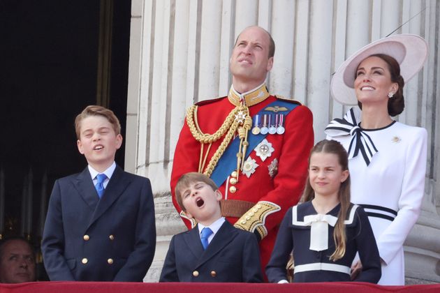 Louis appears to yawn as he stands with his family on the Buckingham Palace balcony.