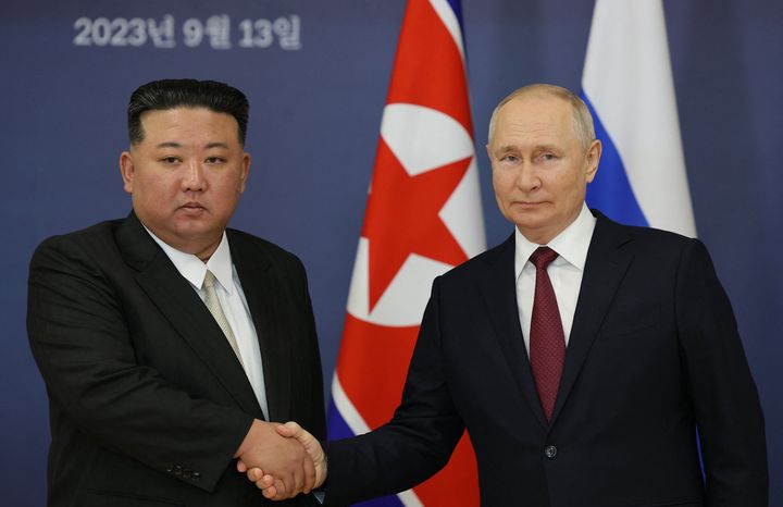 Russian President Vladimir Putin (R) and North Korea's leader Kim Jong Un (L) 
