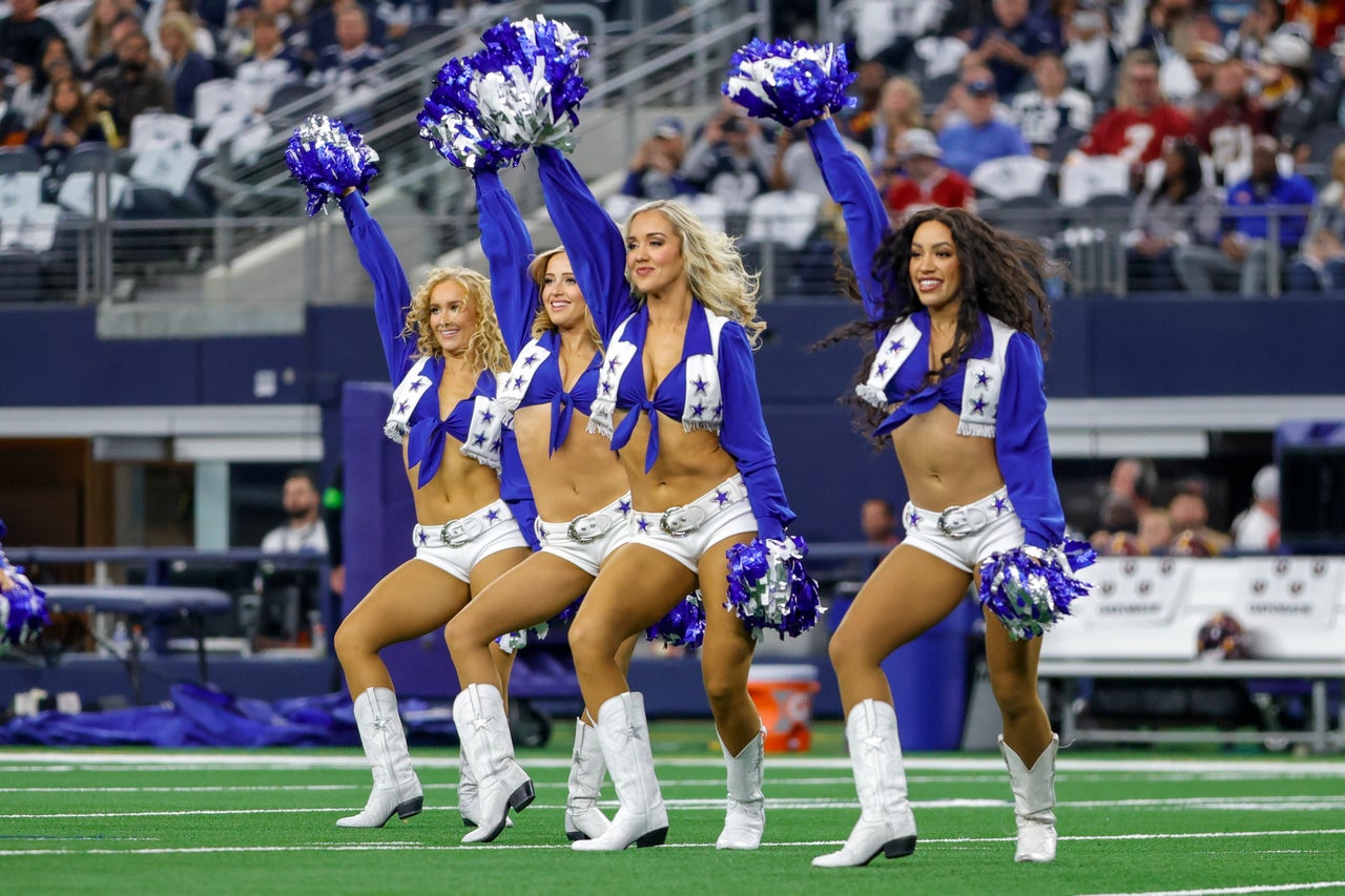 The Dallas Cowboys Cheerleaders perform during a game between the Dallas Cowboys and the Washington Commanders on Nov. 23, 2023, at AT&T Stadium in Arlington, Texas.