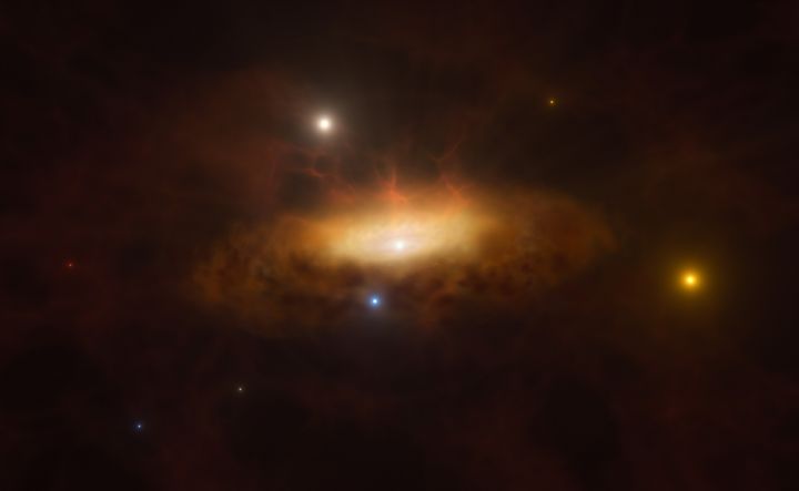 Καλλιτεχνική απεικόνιση που δείχνει τον αυξανόμενο δίσκο υλικού που έλκεται από τη μαύρη τρύπα και κάνει τον γαλαξία να λάμπει.