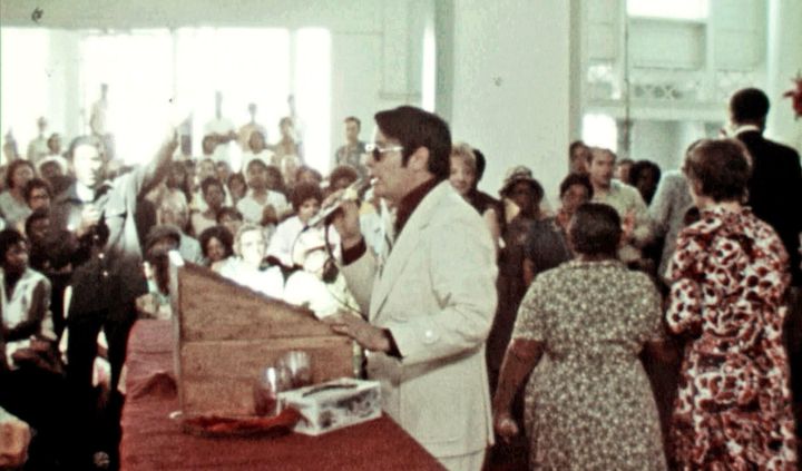 Jim Jones addresses his congregation from the pulpit in California.