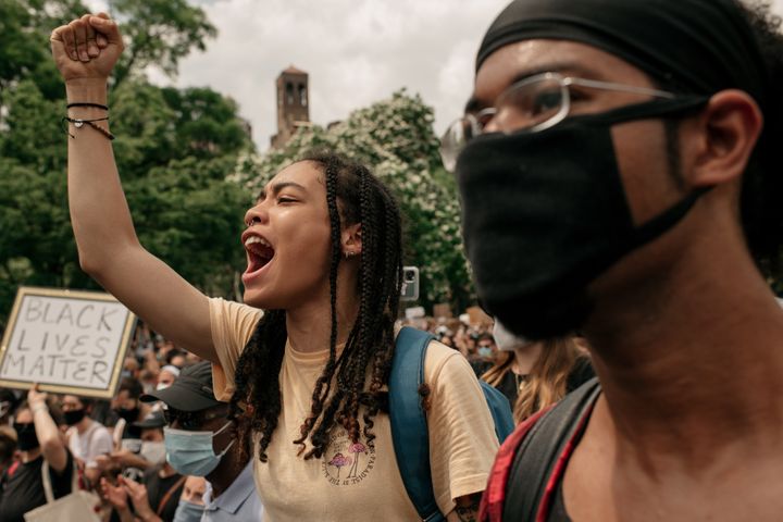 Demonstrators denouncing systemic racism and the police killings of African Americans rally in Washington Square Park in New York City, June 6, 2020.