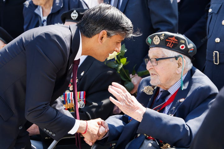 Rishi Sunak meets with a D-Day veteran in Normandy. He later returned early to London.