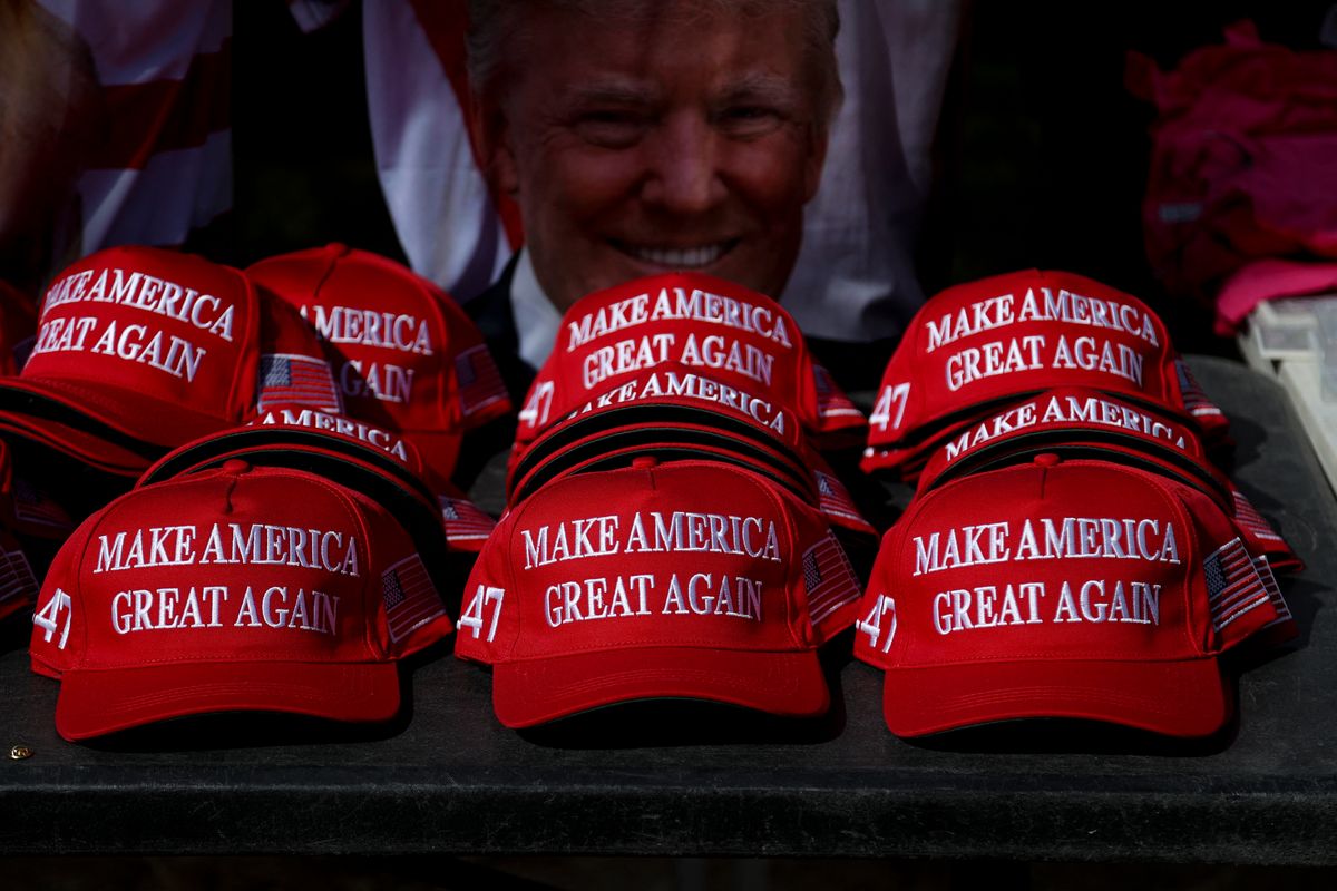 "Make America Great Again" hats sit on a table during a campaign rally for former US President and Republican presidential candidate Donald Trump at Sunset Park in Las Vegas, Nevada on June 9, 2024.