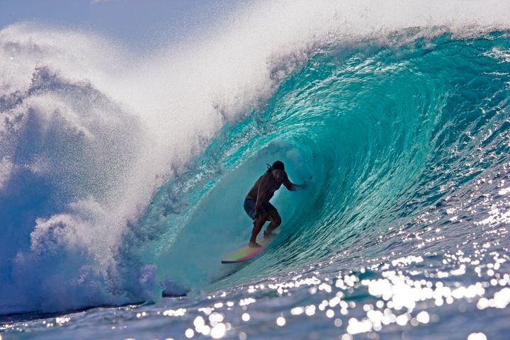 Tamayo Perry surfs practices for the Da Hui Backdoor shootout at the Pipeline Masters on Oahu's North Shore in 2019. 