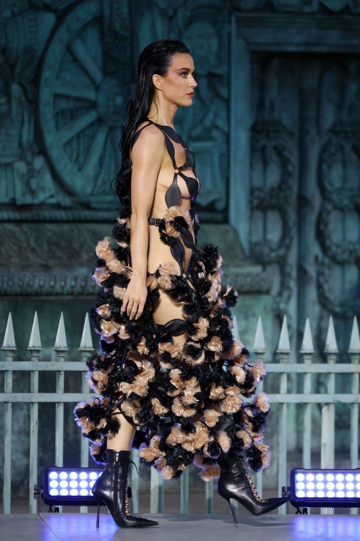 "Make sure it looks like you’re going somewhere, but not in a pop star way," Katy Perry said FKA twigs advised her before she modeled this showstopping Noir by Kei Ninomiya gown in Paris.