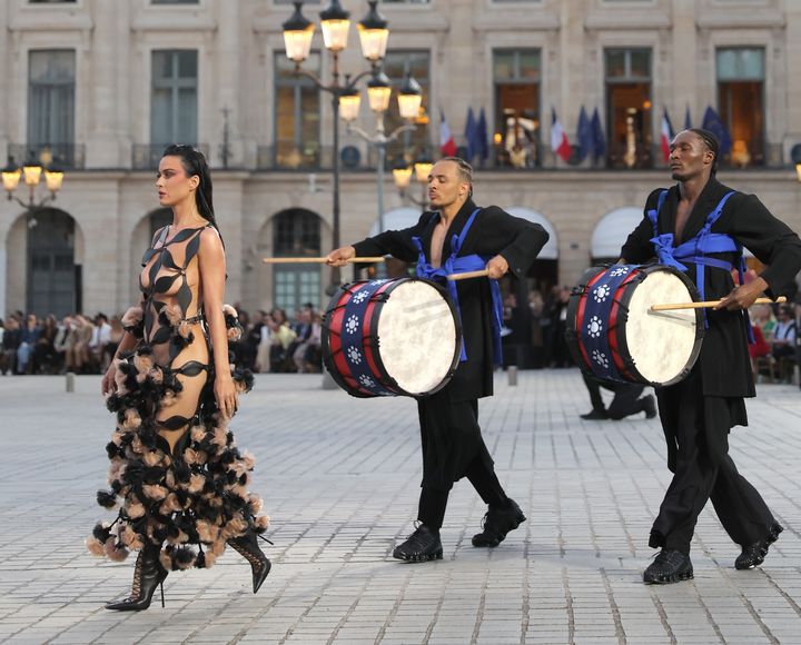 Perry was accompanied by live drummers while walking the runway in Paris.