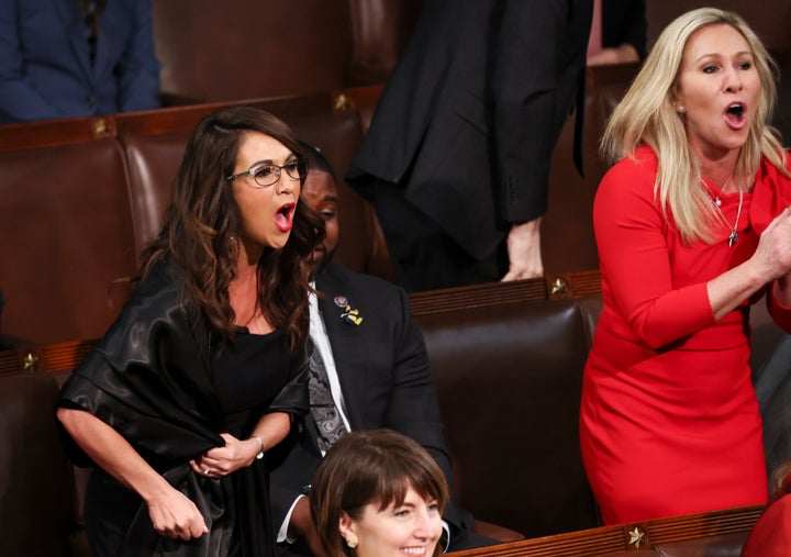 Reps. Lauren Boebert (R-Colo.) and Marjorie Taylor Greene (R-Ga.) scream "Build the wall" as President Joe Biden delivers the State of the Union address during a joint session of Congress on March 1, 2022.