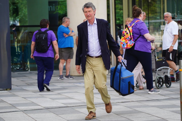 Sir Timothy Laurence leaves Southmead Hospital in Bristol where Princess Anne is being treated on Tuesday.