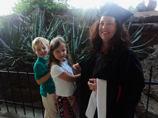 The author is shown with her two children after graduating from the University of St. Thomas.