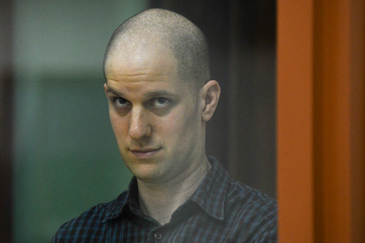 Wall Street Journal reporter Evan Gershkovich stands in a glass cage in a courtroom in Yekaterinburg, Russia, on Wednesday, June 26, 2024.