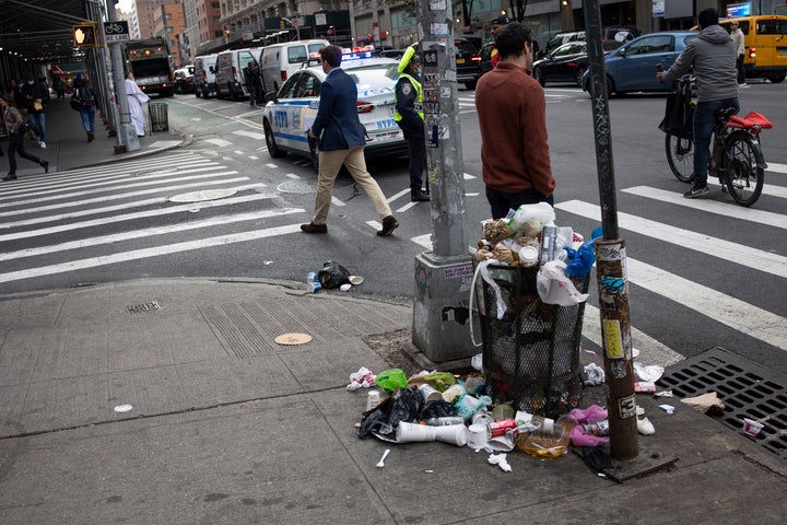 Piles of uncollected garbage overflow on Seventh Avenue in 2021 in Midtown Manhattan. Those in the "no shoes in the house" camp do not want to track said garbage in.