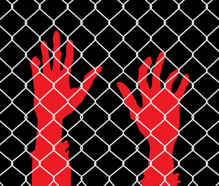 Vector illustration of red raised hands behind a chainlink fence on a black background.