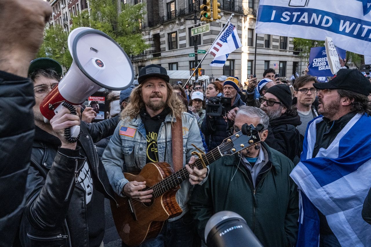 Christian evangelical Sean Feucht, holding a guitar at center, participates in the United for Israel march outside Columbia University on April 25, 2024, in New York City. 