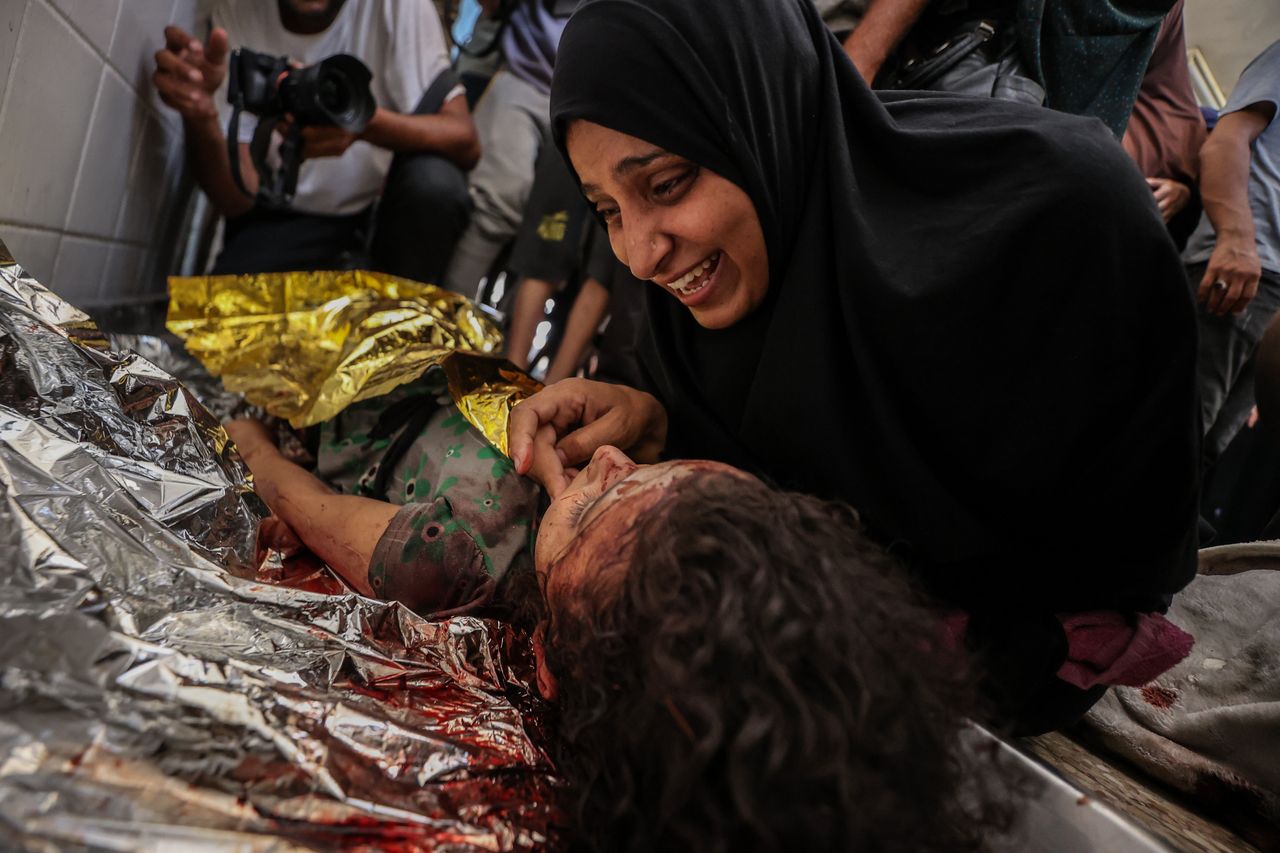 Palestinians mourn loved ones who died in Israeli attacks on the al-Maghazi refugee camp, at Al-aqsa Martyrs Hospital in Deir al-Balah, Gaza, on June 25, 2024. 