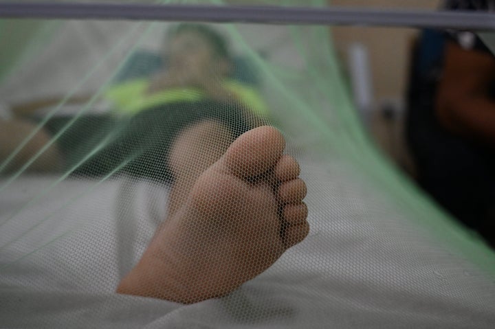 A child sick with dengue lies on a bed at a hospital in Honduras on June 11, 2024. Honduras has recorded at least 20 deaths so far this year due to dengue fever and more than 30,000 suspected cases of infection.