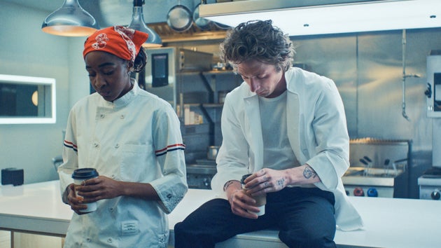 Sydney (Ayo Edebiri) and Carmy (Jeremy Allen White) are shown in season three The Bear.